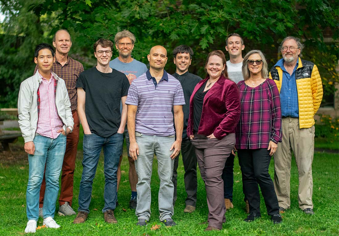 A group photo of the math-stats department faculty standing outside